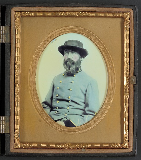Unidentified soldier in Confederate captain's uniform with black cuffs to indicate that he is a surgeon