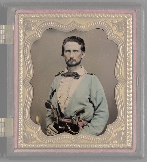 Unidentified soldier from Kentucky in Confederate uniform with two revolvers