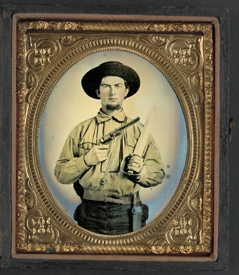 Unidentified soldier in Confederate uniform with Colt Navy revolver and double handle D-guard Bowie knife 