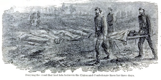 Burying the dead that had lain between the Confederate and Union lines for three days.