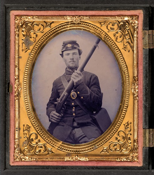Private Jacob Harker of Company C, 120th Ohio Volunteers in uniform with musket and haversack