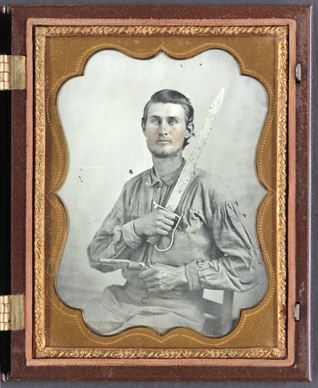 Private Simeon J. Crews of Co. F, 7th Texas Cavalry Regiment, with cut down saber and revolver