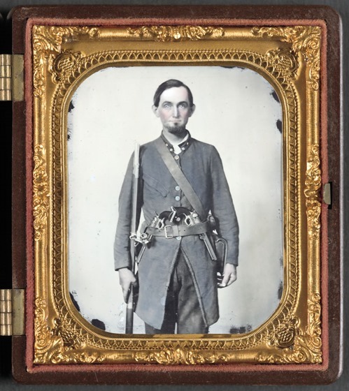 Private Jackson A. Davis of Co. E, Holcombe Legion South Carolina Cavalry Battalion, with musket and two pistols