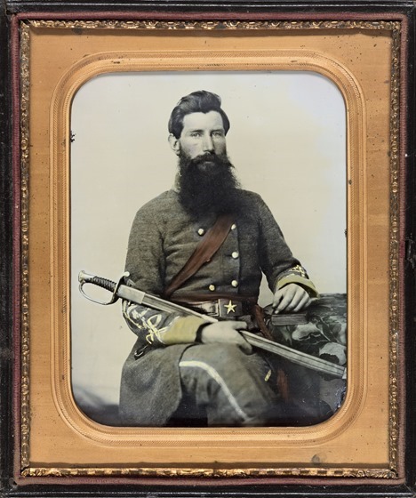 Captain George W. Hackworth of Co. F, 1st Virginia Cavalry Regiment, in uniform with sword in photo case