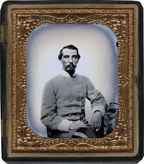 Unidentified soldier in Confederate double-breasted frock coat with single row of braid denoting the rank of lieutenant in photo case