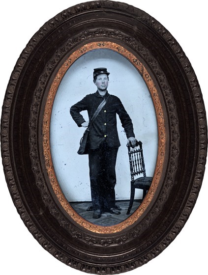 Unidentified young soldier in Union courier uniform and forage cap with haversack