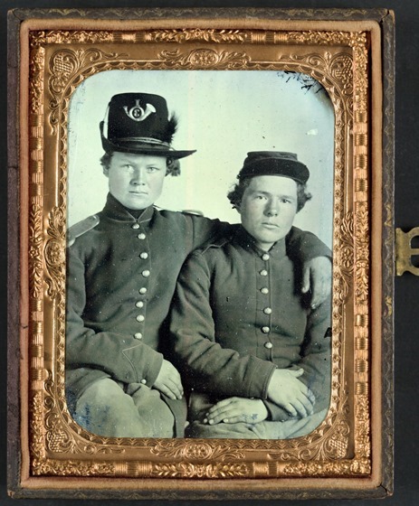 Brothers Private Hiram J. and Private William H. Gripman of Company I, 3rd Minnesota Infantry Regiment, one with his arm around the other -- in frame