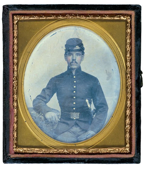Unidentified soldier in Union shell jacket and forage cap with holstered sword