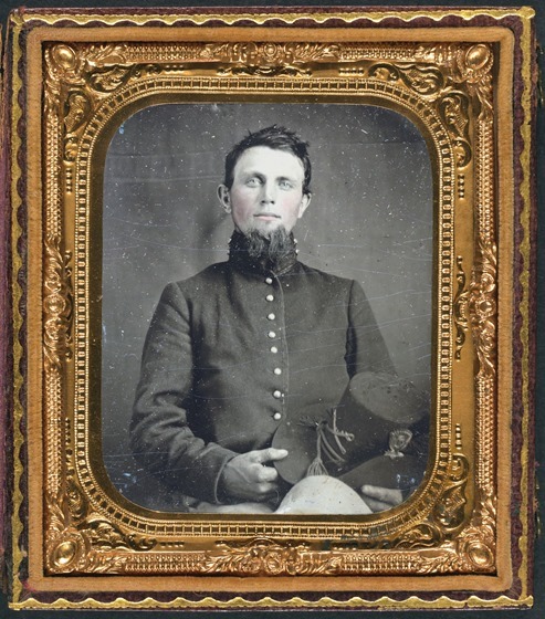 Unidentified soldier in Union uniform holding Hardee hat in case