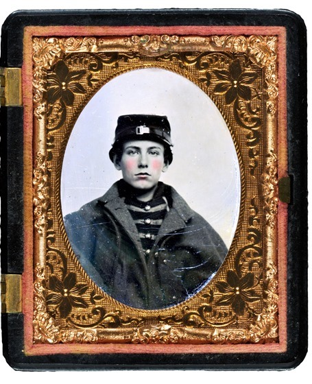 Unidentified young soldier in Union musician's uniform and coat in case