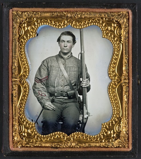 William Jenkins, North Carolina soldier, in artillery uniform, with percussion rifle converted from flintlock - in case