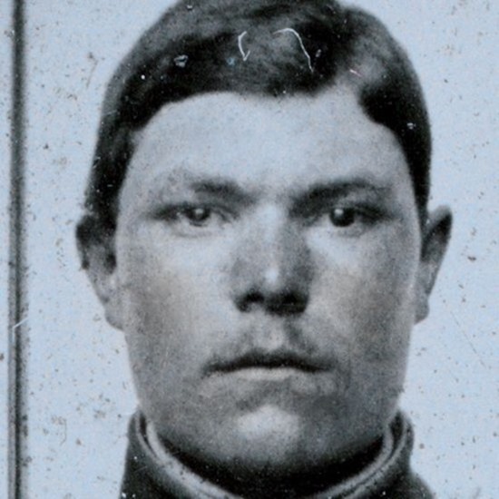 close-up crop of Unidentified soldier in Union frock coat with bayoneted musket
